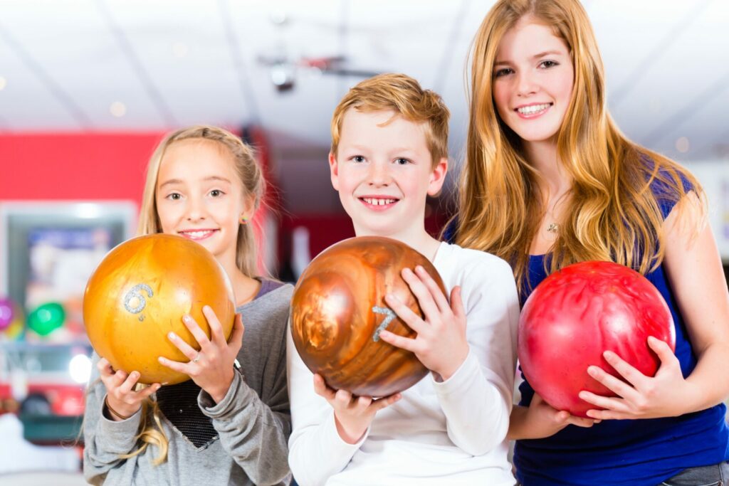 Kids with bowling balls