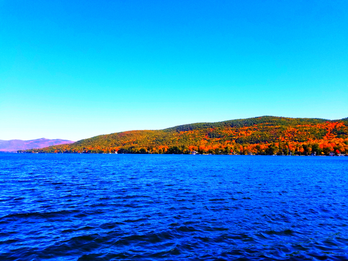 lake george with fall colored leaves in background